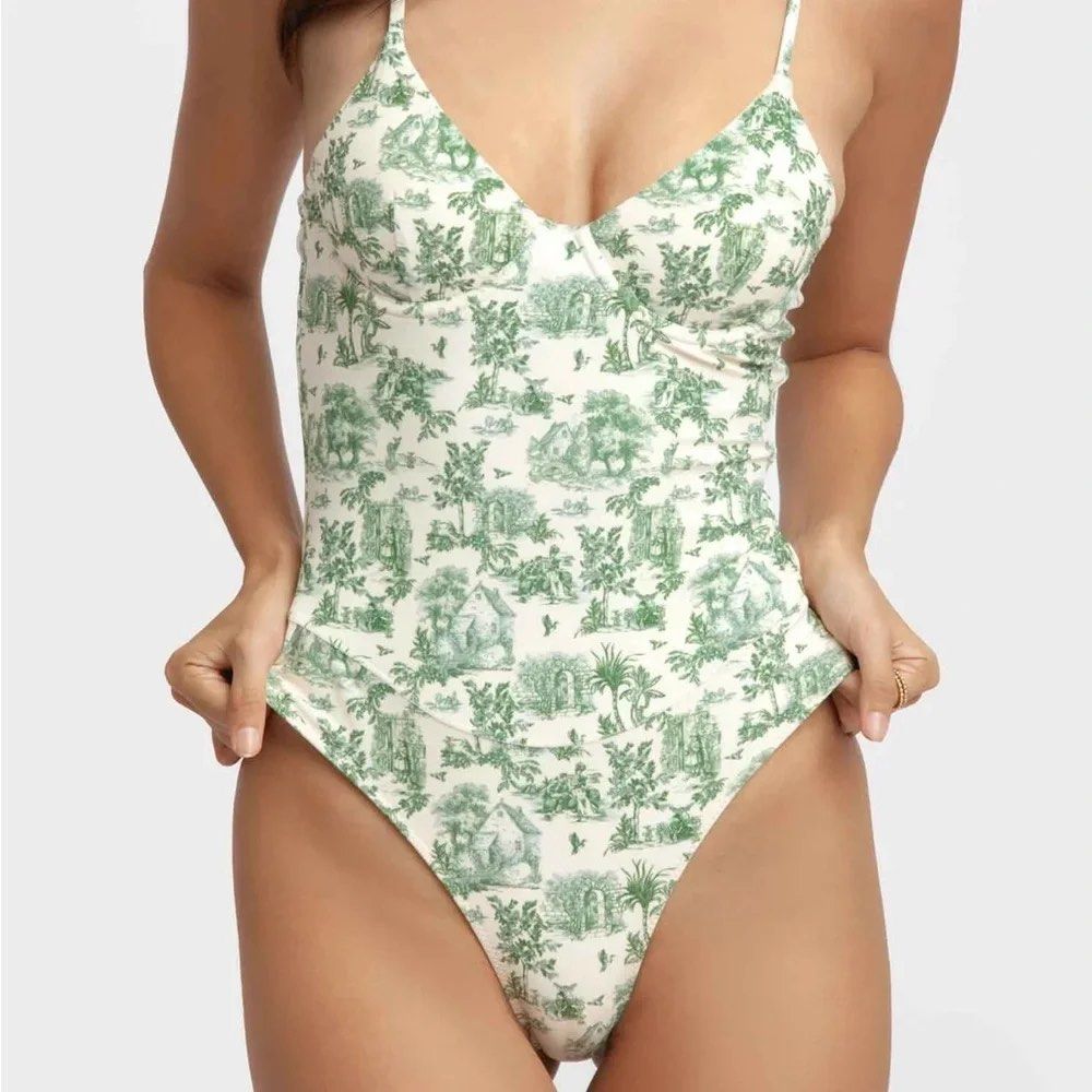 Blackbough Izzy One Piece in Cottage Print (Category: Bikinis & Swimsuits) located in Santo Tomas. Submitted by preloved.jem (Listing ID 1466085326, Image 1). Description: - Brand: Blackbough - Condition: Brand new with tags (BNWT) - Print: Green and white toile de Jouy - Style: One-piece swimsuit with underwire cups - Features: Adjustable spaghetti straps and high-cut leg opening.