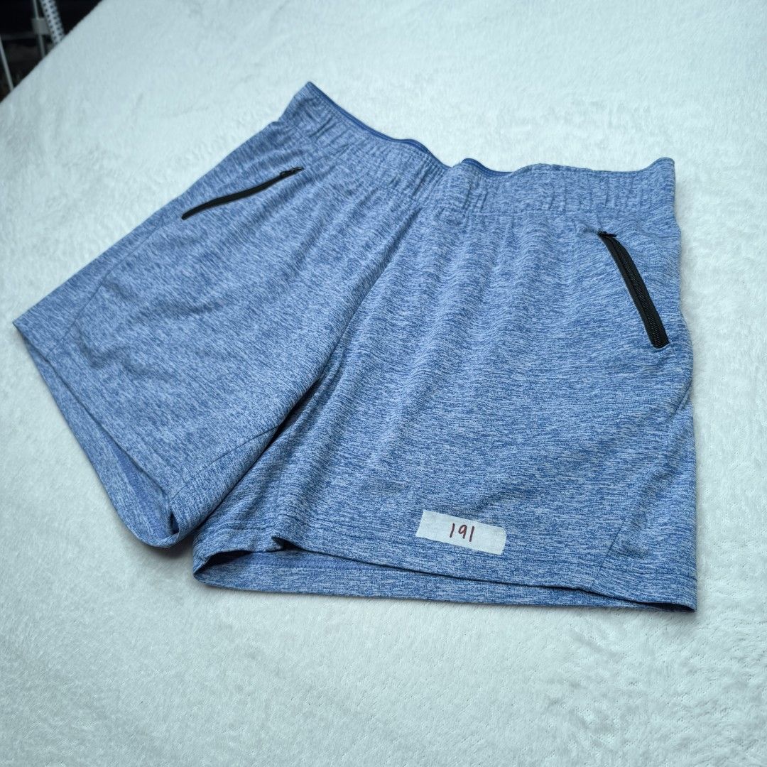 Blue athletic shorts with zipper pockets (Category: Shorts) located in Muntinlupa City. Submitted by jhessiejek (Listing ID 1466052139, Image 3). Description: - Color: Heather Blue -Size:28-38 inches - Secure elastic waistband for runs and gym workouts - Lightweight and stretchy quick-dry material - Two front zipper pockets to keep keys and cards safe.