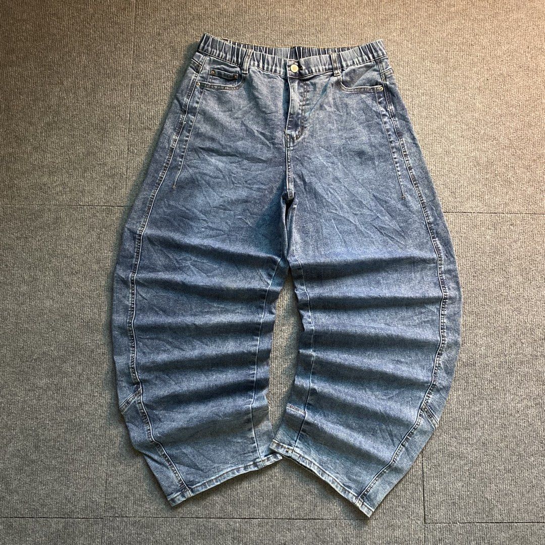 Blue Curved Barrel Leg Jeans (Category: Jeans) located in Malaybalay. Submitted by mat.loots (Listing ID 1466087596, Image 1). Description: - Trendy blue denim jeans with a cool washed finish - Relaxed wide barrel leg cut for a stylish streetwear look - Comfy elastic waistband with button closure - Standard front and back pockets - Measurements available upon request, feel free to send a message for details!.