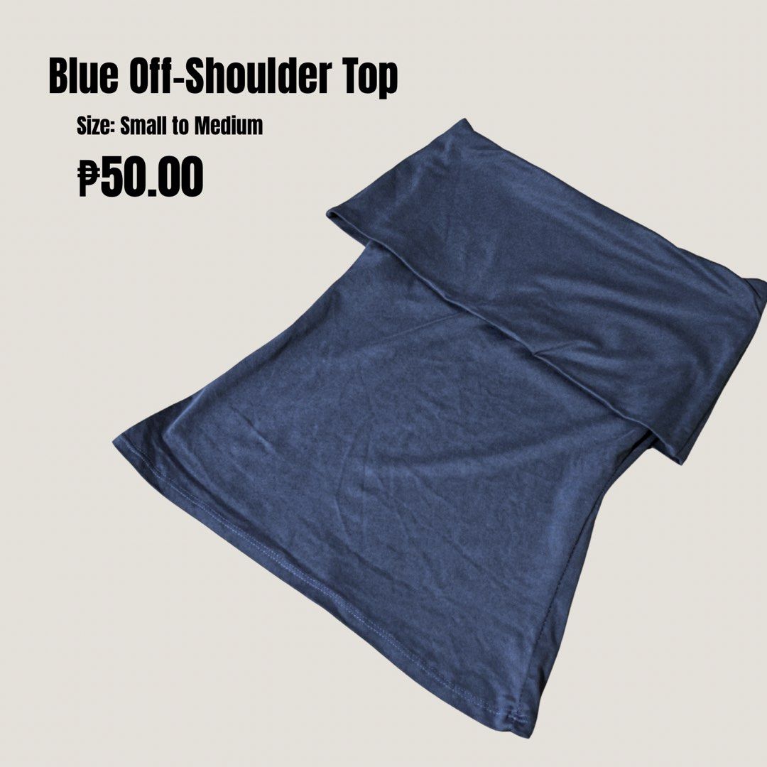 Blue Off-Shoulder Top (Category: Blouses) located in Quezon City. Submitted by declutter_mythings (Listing ID 1466147884, Image 1). Description: - Color: Dark blue - Design: Off-shoulder with foldover neckline - Material: Soft and stretchy - Size: Fits small to medium frames - Condition: Clean and ready to wear - Styling: Great basic piece, easy to match with jeans or skirts for casual outings.