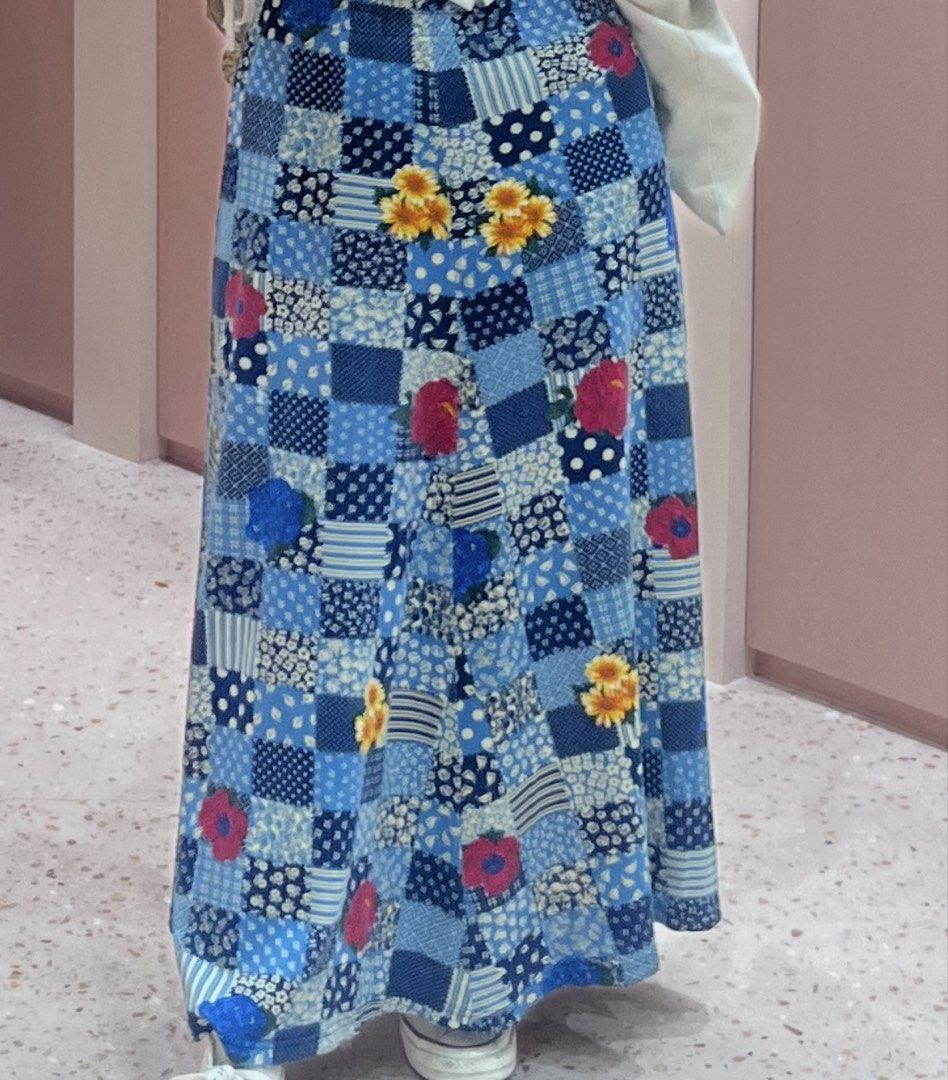 Blue Patchwork Floral Maxi Skirt (Category: Skirts) located in Quezon City. Submitted by jreesey (Listing ID 1465987308, Image 1). Description: Blue Patchwork Maxi Skirt with Flower Design - Purchased on this app in 2024 - The pattern design seems to be more “printed” and flat, NOT manually stitched together like other common patchwork clothes - Has slits below - Says L on tag but prev seller said that it’s more of a free size because of the gart
