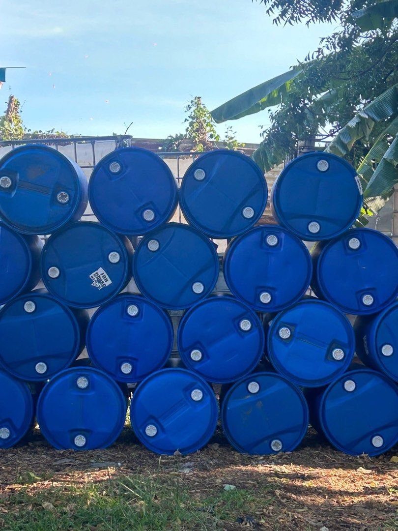 Blue Plastic Drums Storage Containers (Category: Storage Boxes & Baskets) located in Caloocan City. Submitted by zenhorse_acdfa3 (Listing ID 1466031310, Image 1). Description: - Large stack of heavy-duty blue plastic barrels available in bulk - Standard industrial size featuring dual bung holes on top lids - Versatile use: ideal for water storage, DIY projects, compost bins, or farm use - Stored outdoors under trees; units are ready for pickup - 