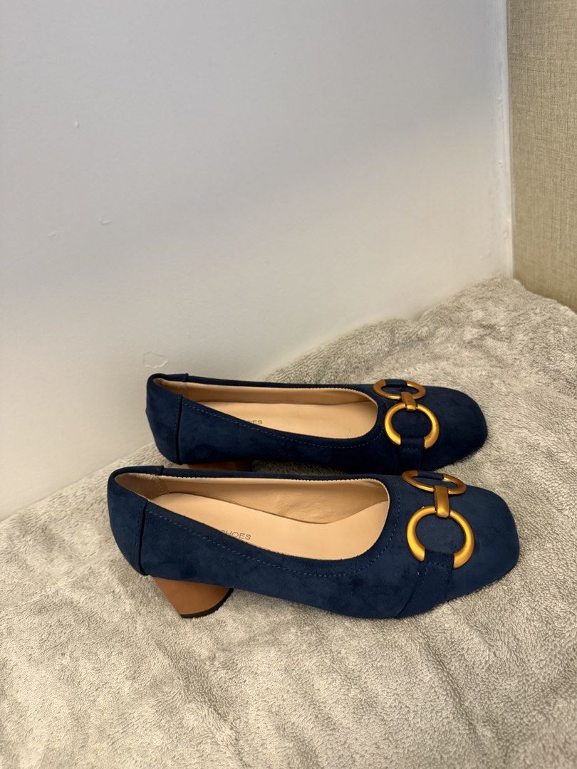 Blue Suede Chunky Heel Pumps Size 34 (Category: Heels) located in Santa Rosa. Submitted by alyssa21 (Listing ID 1465955042, Image 1). Description: - Style: Slip-on heels with a trendy square toe - Color & Material: Navy blue faux suede with wooden-look block heel - Details: Eye-catching gold metal horsebit buckles on the toes - Size: Marked Size 34 on the sole - Condition: Excellent, clean insoles and soles show virtually no wear.