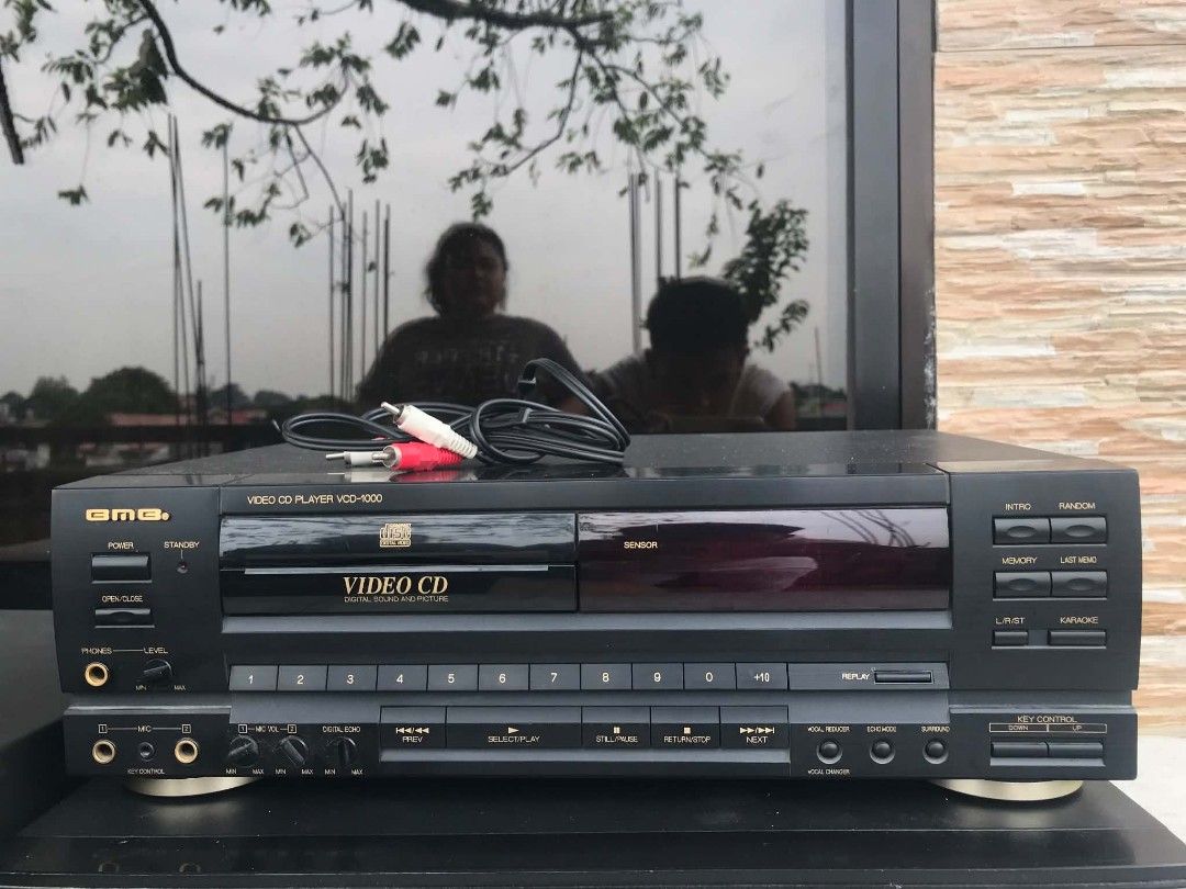BMB VCD-1000 Video CD Player Karaoke System (Category: Blu-Ray & Media Players) located in Quezon City. Submitted by davidmelvin28 (Listing ID 1465972878, Image 1). Description: - Model: BMB VCD-1000 Video CD Player - Color: Sleek black finish with elegant gold lettering - Karaoke Ready: Equipped with dual microphone jacks, key control dials, and digital echo adjustments - Controls: Standard front panel button layout for easy track selection and 