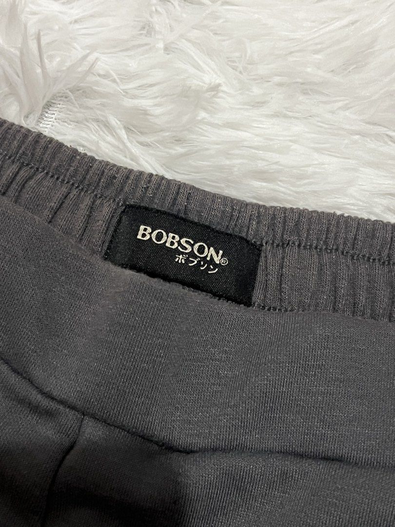 Bobson Gray Sweatpants Joggers Lounge Pants (Category: Joggers) located in Tuguegarao City. Submitted by love_clothies (Listing ID 1465960298, Image 2). Description: - Brand: Bobson - Color: Gray - Style: Straight cut with front center seam details - Waistband: Elastic for maximum comfort - Features: Small brand label near the pocket, soft fabric - Best for: Lounging at home or running errands - Width: 15 inch (21 inch max), Length: 37 inch.