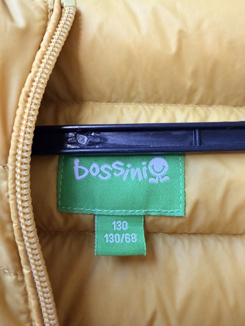 Bossini Yellow Puffer Jacket Size 130 (Category: Babies & Kids Fashion) located in Las Pinas. Submitted by ramech0105 (Listing ID 1465963402, Image 2). Description: - Brand: Bossini - Color: Bright yellow - Size: 130/68 - Design: Padded quilted puffer jacket with zip-up front and attached hood - Pockets: Two front pockets - Condition: Clean exterior and lining, well kept, very warm for cold weather.