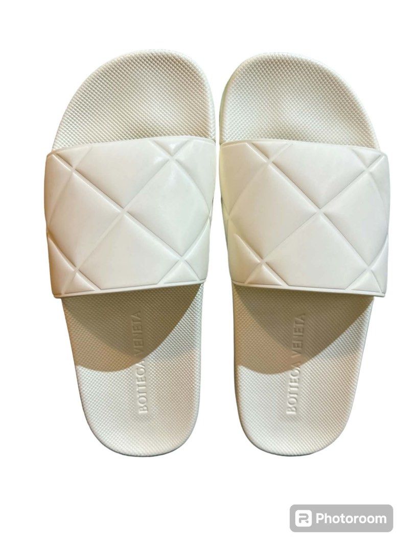 Bottega Veneta White Quilted Rubber Slides (Category: Sneakers & Footwear) located in Manila. Submitted by attypreciousyzncpa (Listing ID 1466150262, Image 2). Description: - Brand: Bottega Veneta - Color: Clean White - Style: Slip-on pool slides with signature padded cassette weave strap - Comfort: Textured footbed with debossed brand logo for extra grip and comfort - Condition: Excellent / As described - Perfect for: Casual days out, beach trip