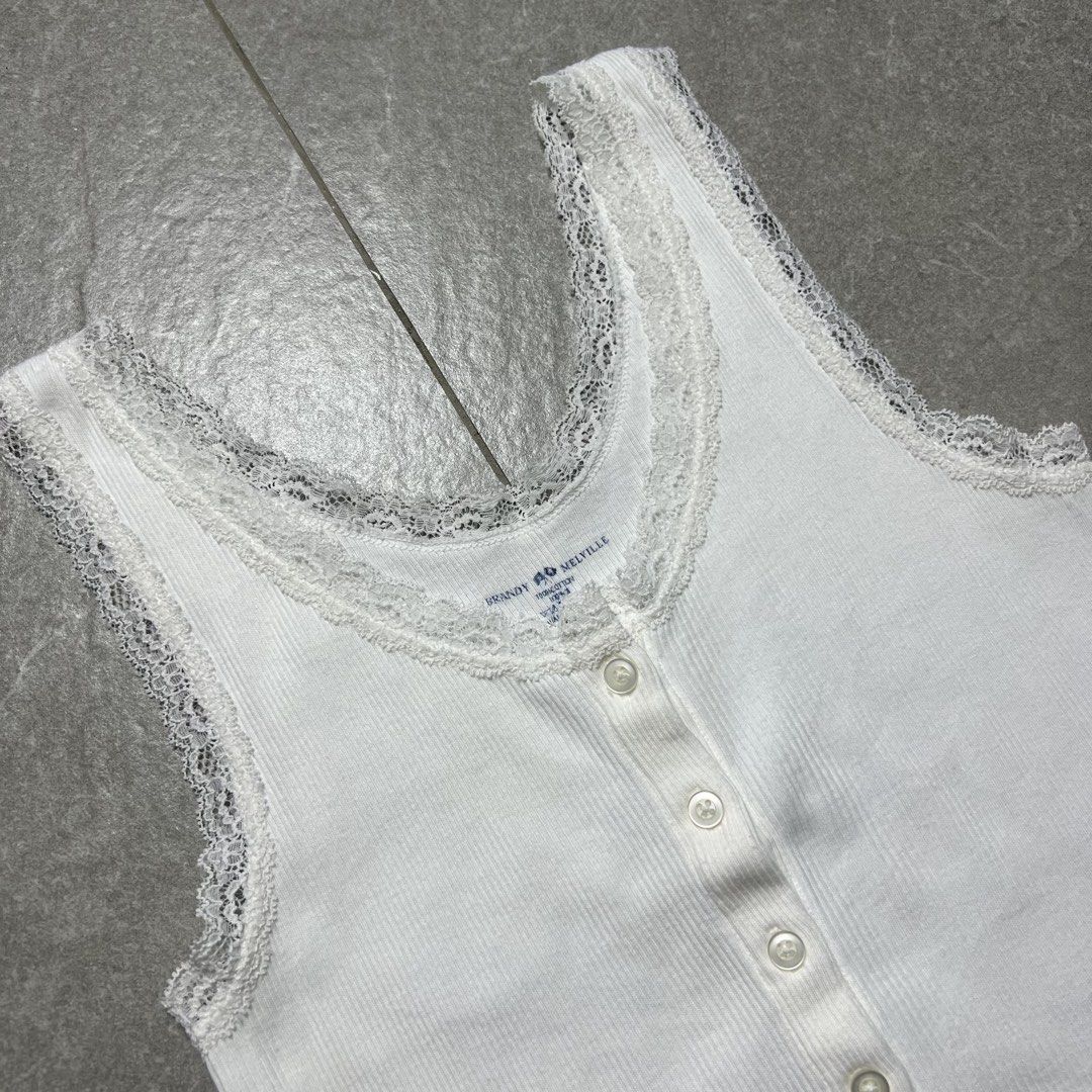 Brandy Melville Lace Button Top (Category: Sleeveless) located in Manila. Submitted by stakkhaus_ (Listing ID 1466060960, Image 2). Description: Brandy Melville Lace Button Top Excellent Condition Small frame Width 13 Length 20.