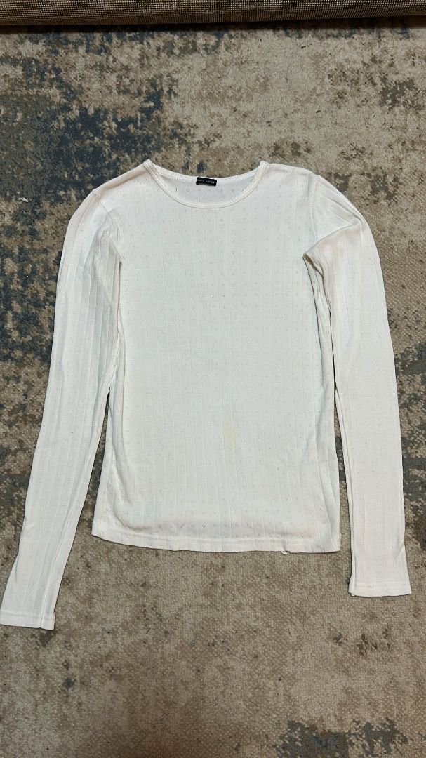 Brandy melville white long sleeve (Category: Coats, Jackets and Outerwear) located in Manila. Submitted by cvntlab (Listing ID 1466123161, Image 1). Description: has minimal stain actual photo posted .