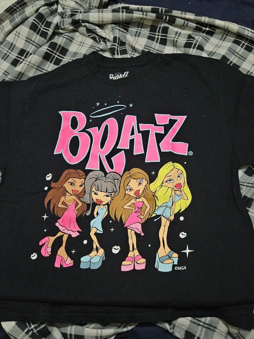 Bratz Black Graphic Print T-Shirt Medium (Category: Shirts) located in General Trias. Submitted by averageukayenjoyer (Listing ID 1466053907, Image 1). Description: - Color: Black with pink and blue Bratz graphic - Size: Medium - Material: 100% cotton (Made in Haiti) - Care: Machine wash cold - Style: Casual Y2K streetwear basic.