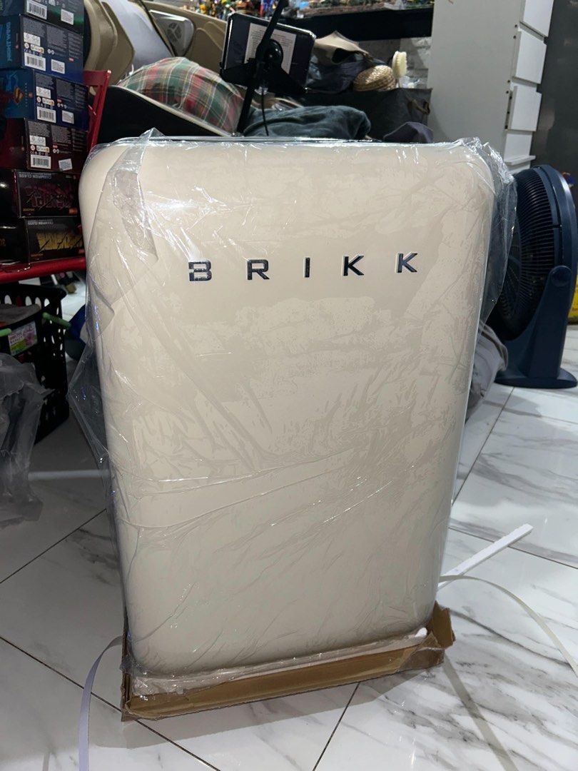 BRIKK Cream Retro Mini Fridge (Category: Refrigerators and Freezers) located in Taguig. Submitted by _nicsss (Listing ID 1466019301, Image 1). Description: - Brand: Brikk - Color: Cream with stylish silver lettering - Style: Retro design with rounded corners - Condition: Brand new, never plugged in or used (still has exterior protective plastic and cardboard base) - Storage: 3 removable glass shelves and convenient door storage racks - Ideal For: