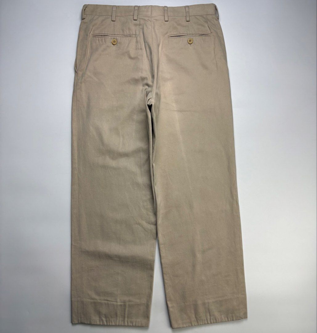 Brioni Khaki Flat Front Trousers (Category: Chinos) located in Cavite. Submitted by sc_rcity (Listing ID 1466050346, Image 3). Description: Tagged Size : 32 R Men’s Authentic In Great Condition Zipper : Ykk Made in Italy No Inclusion feature a clean, straight-leg silhouette with an extended tab button waist closure, slip pockets, and a classic mid-rise fit characteristic of Brioni’s Italian tailoring. Note : Color may vary due to lighting Measure