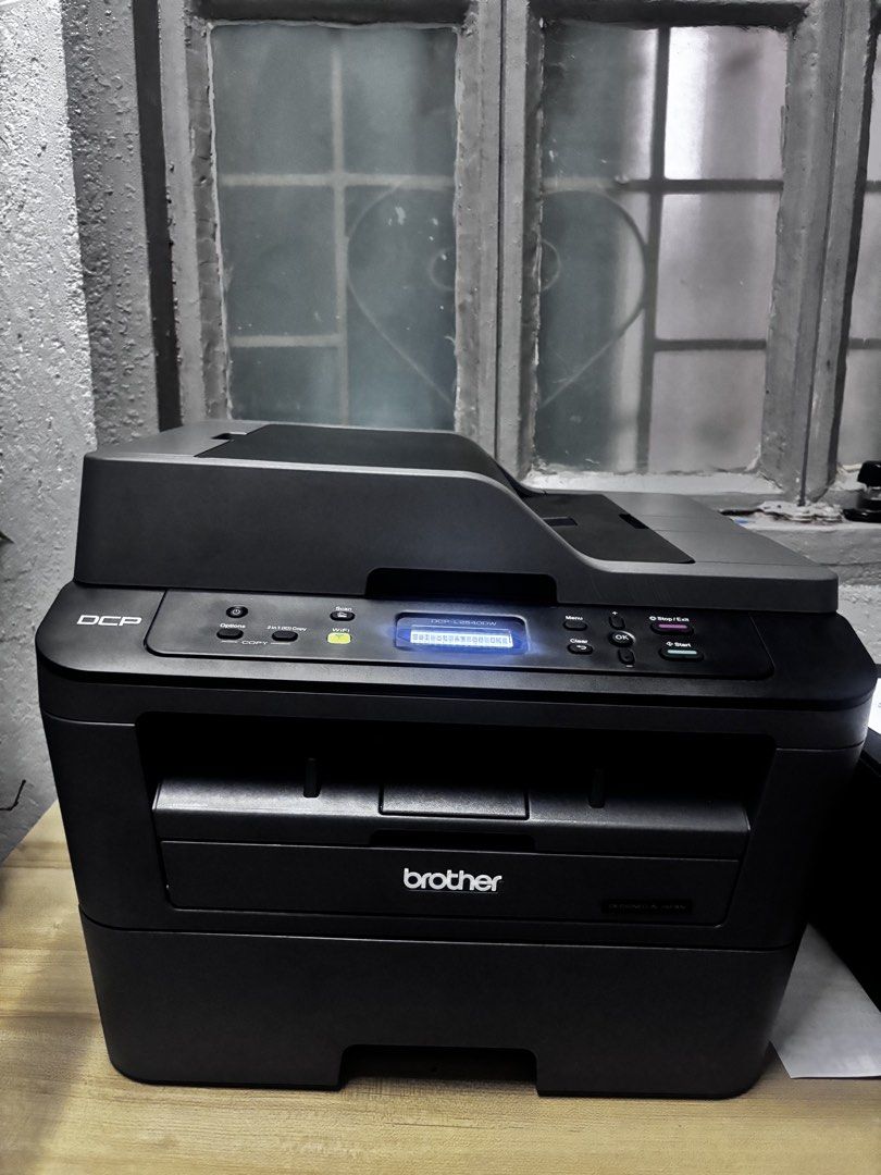 Brother DCP-L2540DW All-in-One Laser Printer (Category: Printers, Scanners & Copiers) located in Manila. Submitted by sarjielca (Listing ID 1466055782, Image 2). Description: - used only for a month - rarelu used - with extra catridge - with box Model: Brother DCP-L2540DW Monochrome Laser Printer - Features: Built-in Wi-Fi, scanner, and automatic document feeder (ADF) - Design: Compact unit with flatbed document glass, bottom-front paper tray, an