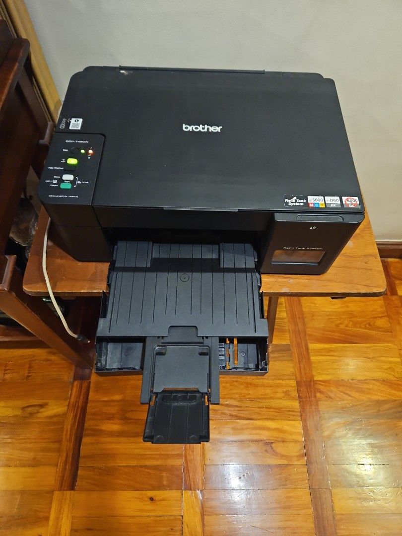 Brother DCP-T420W Refill Tank System Printer (Category: Printers, Scanners & Copiers) located in Quezon City. Submitted by edensc (Listing ID 1466071338, Image 2). Description: - Model: Brother DCP-T420W All-in-One Printer (Black) - System: Refill Tank System for low-cost, high-volume printing - Design: Compact desktop footprint with paper input tray and top-left control panel - Functions: Print, scan, and copy - Power: Standard cable connection 
