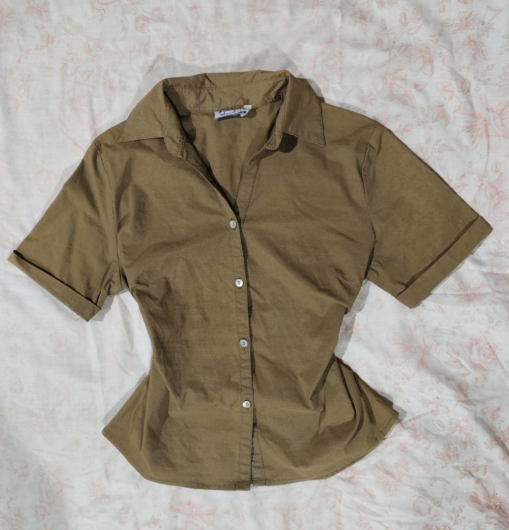 brown button-up collared shirt blouse (Category: Blouses) located in Bulacan. Submitted by angel.decluttersx (Listing ID 1466015329, Image 1). Description: medium size on tag thick smooth fabric material no issue.