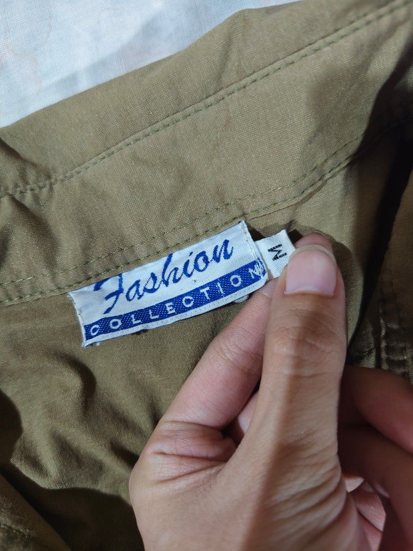 brown button-up collared shirt blouse (Category: Blouses) located in Bulacan. Submitted by angel.decluttersx (Listing ID 1466015329, Image 3). Description: medium size on tag thick smooth fabric material no issue.