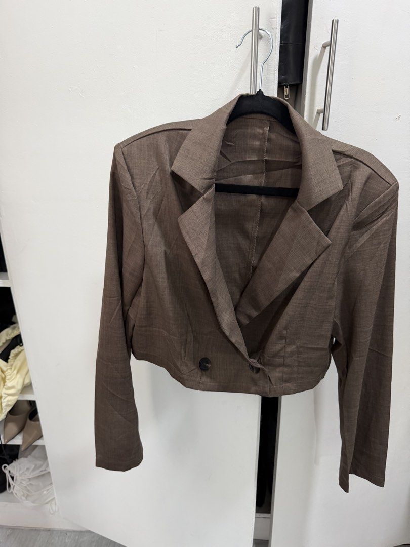 Brown cropped blazer long sleeve jacket double breasted (Category: Coats, Jackets and Outerwear) located in Pasig City. Submitted by miss_abuelita (Listing ID 1465984240, Image 2). Description: With shoulder pads length 16” shoulder to shoulder 17”.