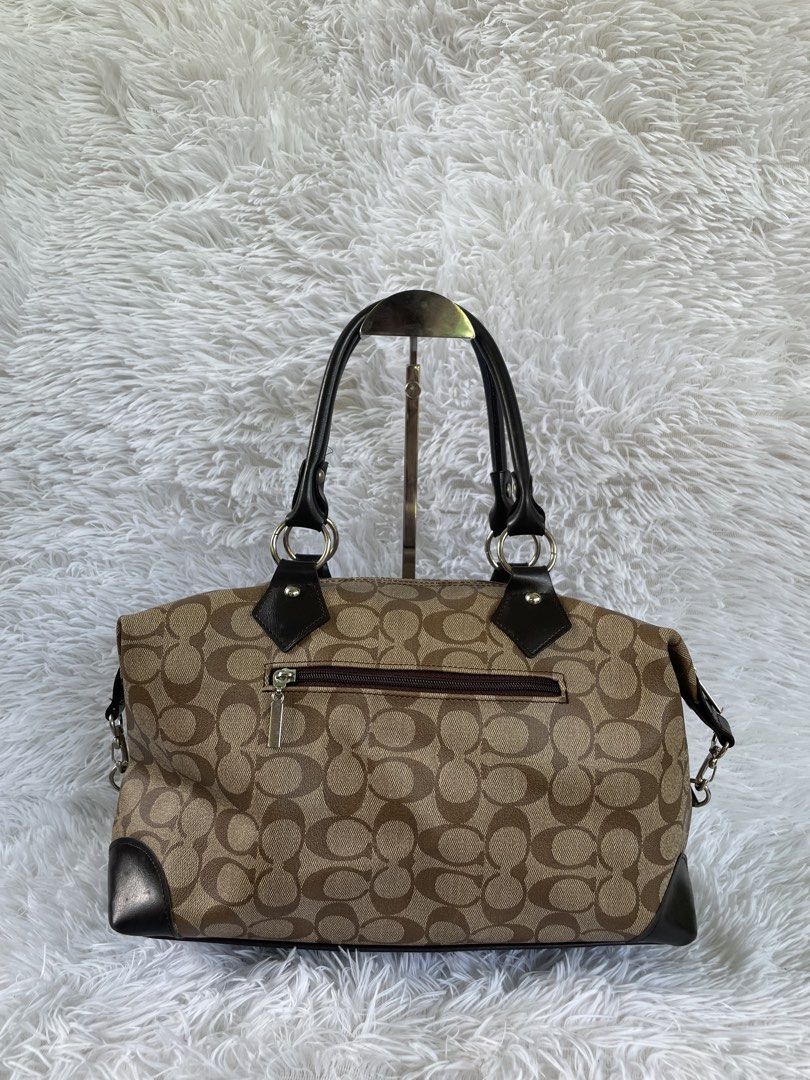 Brown Signature Monogram Pattern Shoulder Bag (Category: Shoulder Bags) located in San Carlos. Submitted by jessamaep_deer (Listing ID 1465993282, Image 1). Description: - Brown canvas monogram shoulder bag - Dark brown leather trim on handles and corners - Exterior zippered pocket on the back - Secure top zipper closure - Dark satin lining with interior slip pockets - Twin grab handles with silver-toned hardware - Spacious interior for daily ess
