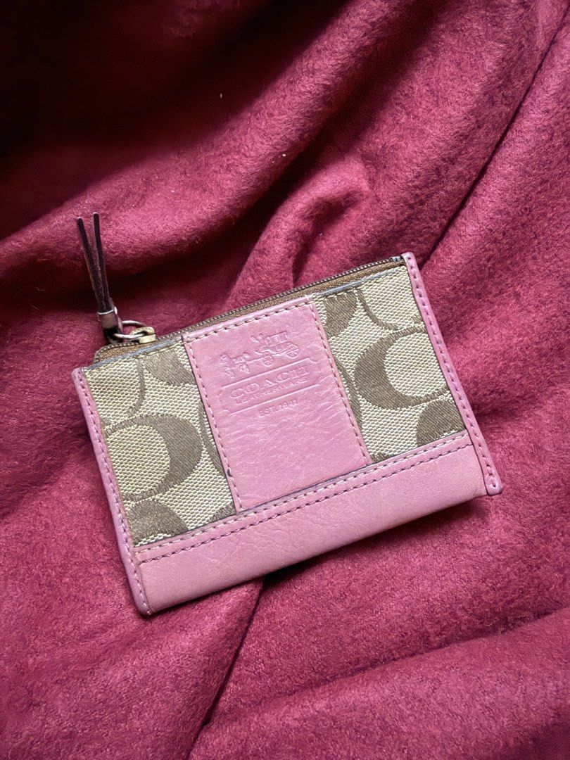 BUNDLE FREE BAG (Category: Luxury Bags & Wallets) located in Manila. Submitted by angelcurated (Listing ID 1465974758, Image 2). Description: - Brand: Coach - Design: Pink signature C canvas with solid pink leather trim - Closure: Top zip closure with pull tab - Interior: Clean pink fabric lining with embossed Coach creed patch - Condition: Clean interior and exterior - Size: Compact, fits easily into smaller bags or pockets.