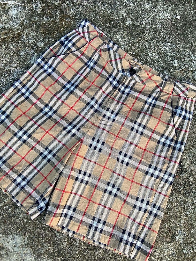 Burberry Check Pleated Shorts (Category: Shorts) located in Davao. Submitted by drayliii (Listing ID 1466064427, Image 3). Description: Burb nova checked short womens Size 27-28 Length 18 Excellent 480 add ship Davao city - Authentic Burberry check pattern in beige, red, and black - Mid-rise waist with belt loops and front button closure - Classic tailored fit ending right above the knee - Functional slanted side pockets and back welt pockets - V