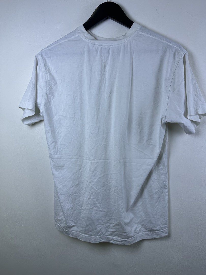Burberry Monogram TB Logo White T-Shirt (Category: Shirts) located in Manila. Submitted by declutterpromax (Listing ID 1466014884, Image 3). Description: - Burberry TB Monogram T-Shirt - Color: Crisp White with Black Rubber TB Logo Patch - Material: Premium 100% Cotton (Made in Portugal) - Fit: Classic crew neck, short sleeves, regular fit - Details: Includes interior Burberry London England collar tag - Condition: Brand new / Excellent daily cas