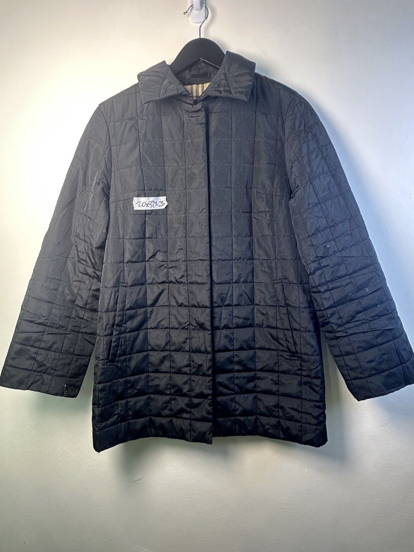 Burberry Quilted Black Jacket (Category: Coats, Jackets and Outerwear) located in Manila. Submitted by declutterpromax (Listing ID 1466025783, Image 1). Description: - black quilted Burberry jacket - Iconic classic check inner collar - Button-front closure with deep side pockets - Condition note: Noticeable wear, fraying, and small tears along the sleeves - Ideal DIY restoration project for vintage outerwear lovers - Selling as-is, message for in