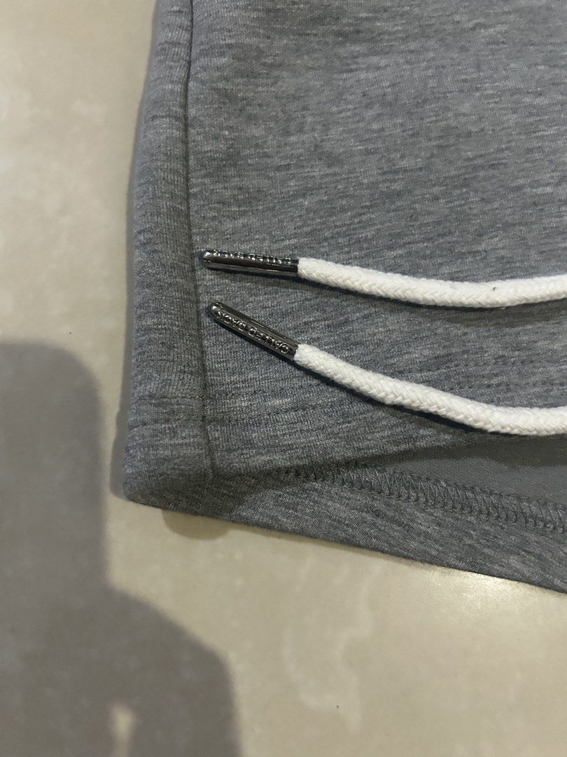 CALLED BACK Grey Athletic Shorts XS (Category: Activewear) located in San Fernando. Submitted by thrift_lang_ni_kim (Listing ID 1466097966, Image 3). Description: - Brand: CALLED BACK - Style/Model: CB240808 - Size: XS - Condition: Brand new with original store tags attached - Color: Grey - Features: High ribbed waistband, white drawstring cords with branded metal aglets, and small white front logo text.