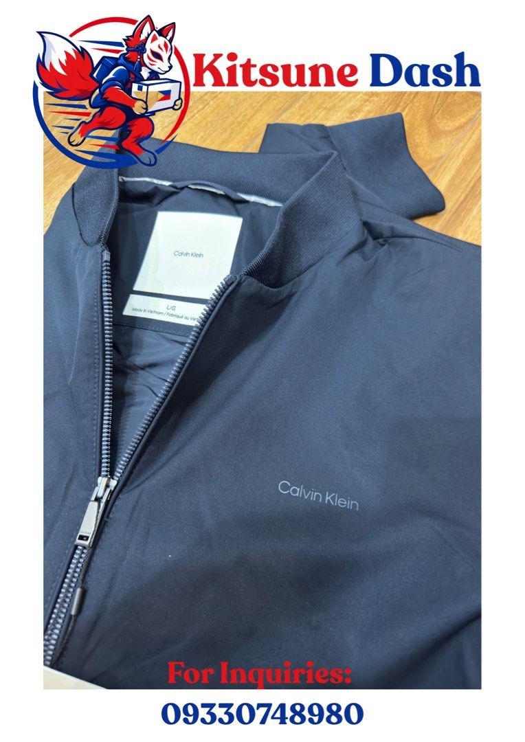 Calvin Klein Bomber Jacket (Category: Coats, Jackets and Outerwear) located in Cavite. Submitted by justblue1921 (Listing ID 1466001976, Image 1). Description: - Brand: Calvin Klein - Style: Zip-up bomber jacket - Color/Design: Clean dark design, easy to match - Size: XL,L - Details: Ribbed collar and cuffs, subtle tonal embroidered logo on chest - Closure: Full front zipper with metallic pull - Condition: Brand new from US 🇺🇸.