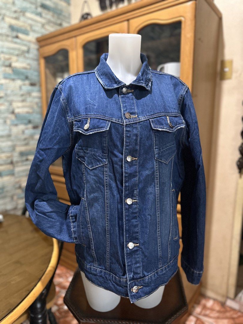 Calvin Klein Jeans Denim Jacket (Category: Coats, Jackets and Outerwear) located in Rizal. Submitted by shoppables (Listing ID 1466000128, Image 3). Description: - Brand: Calvin Klein Jeans - Color: Classic Blue - Material: Durable cotton denim with contrast stitching - Design: Button-up front, two chest flap pockets, and side welt pockets - Details: Iconic CK logo patch on the lower back hem - Fit: Versatile layering piece perfect for daily wear