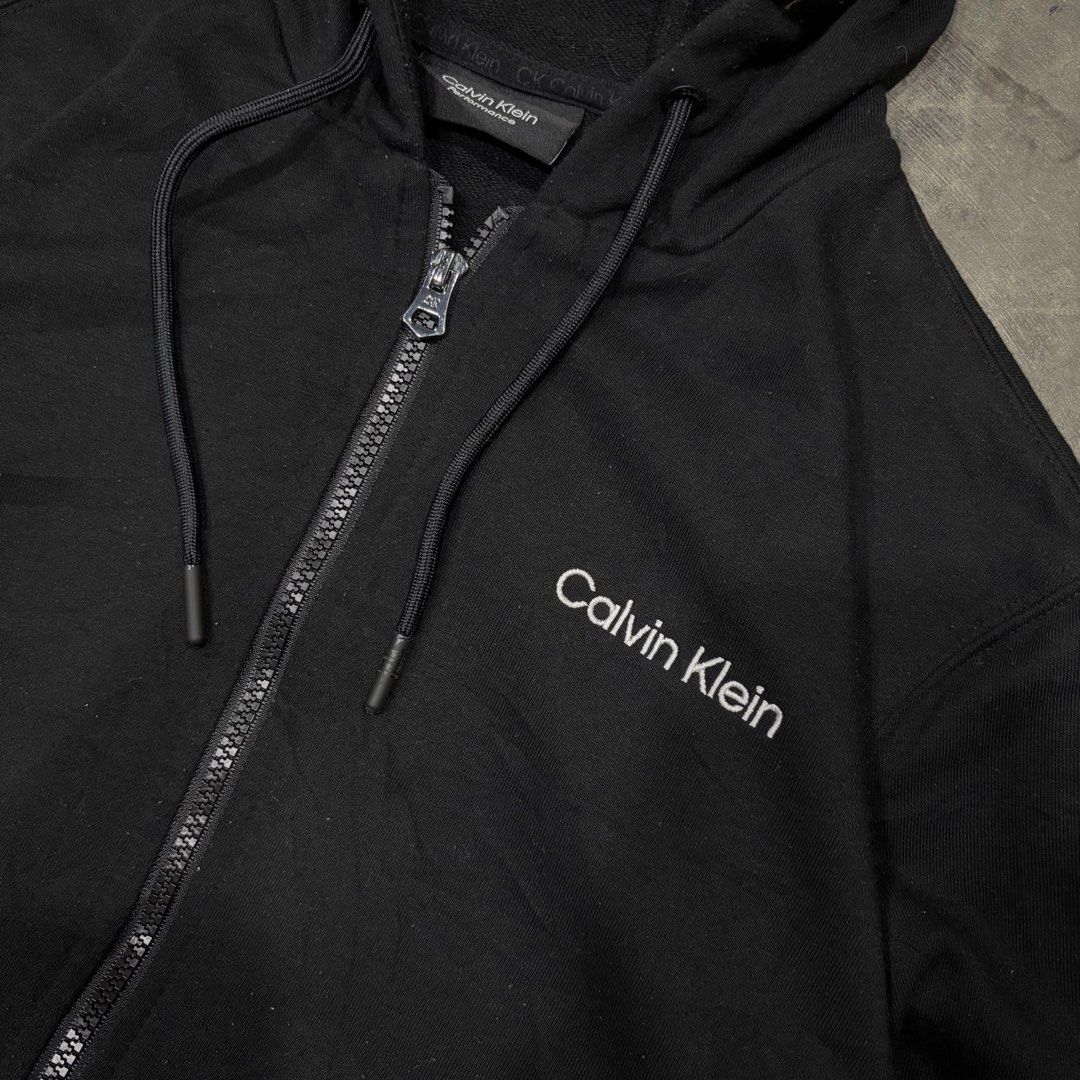 Calvin Klein Zip Up Hoodie (Category: Coats, Jackets and Outerwear) located in General Santos City (Dadiangas). Submitted by rags2reviveph (Listing ID 1466065878, Image 3). Description: Calvin Klein Zip Up Hoodie Medium width 20 | length 26 Excellent.