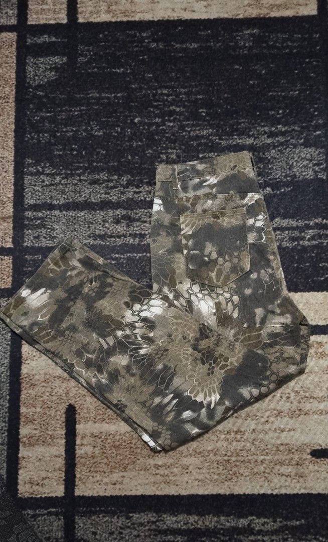 Camo Pattern Casual Pants Tactical Style (Category: Jeans) located in Manila. Submitted by ianmontede19006 (Listing ID 1466010886, Image 1). Description: - Green and grey camouflage pattern with digital honeycomb texture - Classic 5-pocket denim style construction - Secure button closure at the waist - Straight leg cut with standard belt loops - Made with durable and sturdy fabric.
