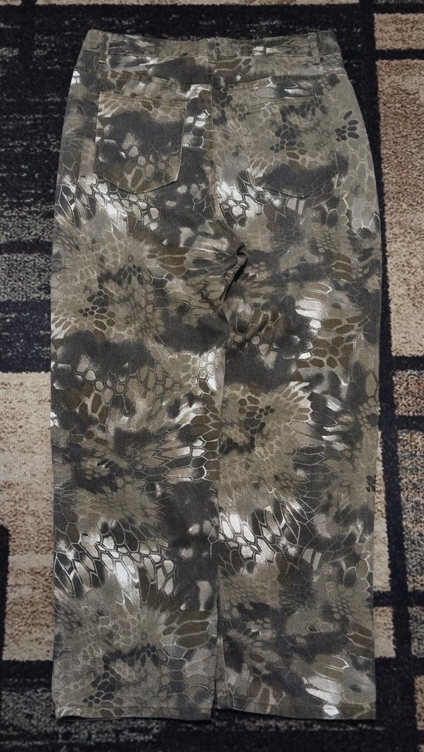 Camo Pattern Casual Pants Tactical Style (Category: Jeans) located in Manila. Submitted by ianmontede19006 (Listing ID 1466010886, Image 2). Description: - Green and grey camouflage pattern with digital honeycomb texture - Classic 5-pocket denim style construction - Secure button closure at the waist - Straight leg cut with standard belt loops - Made with durable and sturdy fabric.