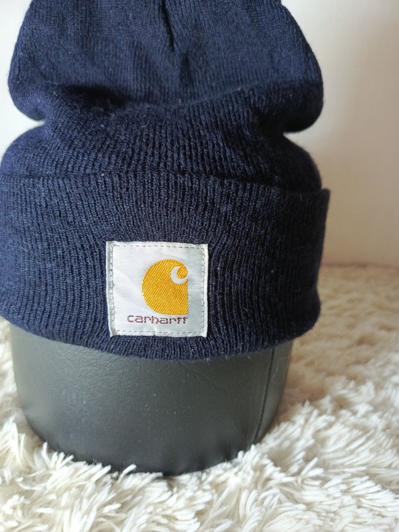 CARHARTT BONNET (Category: Caps & Hats) located in Baguio. Submitted by 074thriftmania (Listing ID 1466116896, Image 2). Description: - Brand: Carhartt - Color: BLACK - Style: Classic cuffed ribbed knit beanie with front logo patch - Material: Thick, warm, and durable - Condition: Solid and well-maintained (note: minor fraying on the inside tag, does not affect wear).