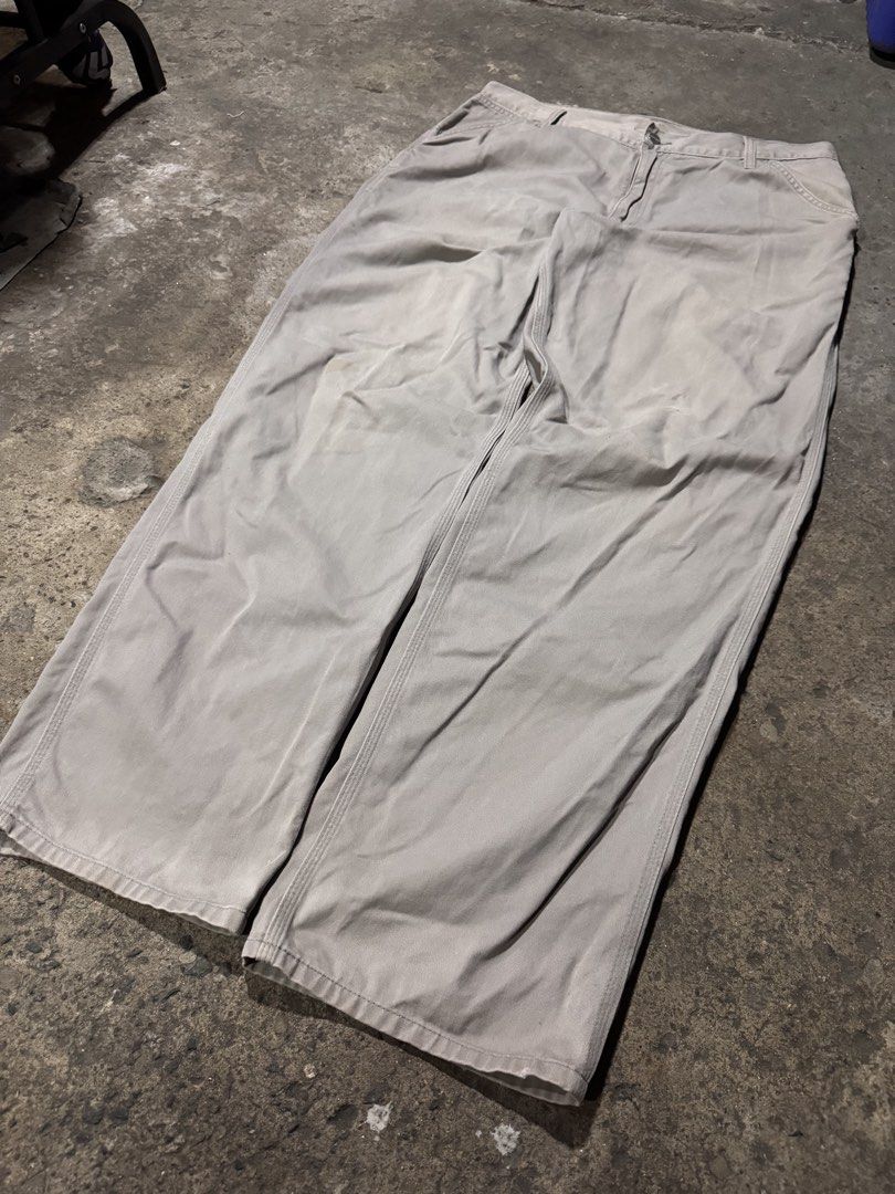 Carousell Carhartt Work Pants Grey Utility (Category: Jeans) located in Pasig City. Submitted by dripthrift1600 (Listing ID 1466101122, Image 3). Description: - Brand: Carhartt - Color: Grey - Material: Durable canvas - Fit: Relaxed fit through the leg - Features: Multiple utility pockets, hammer loop, branded metal button closure, and classic logo patch - Condition: Regular signs of wear throughout, perfect everyday workwear staple - Dimes: 36x4