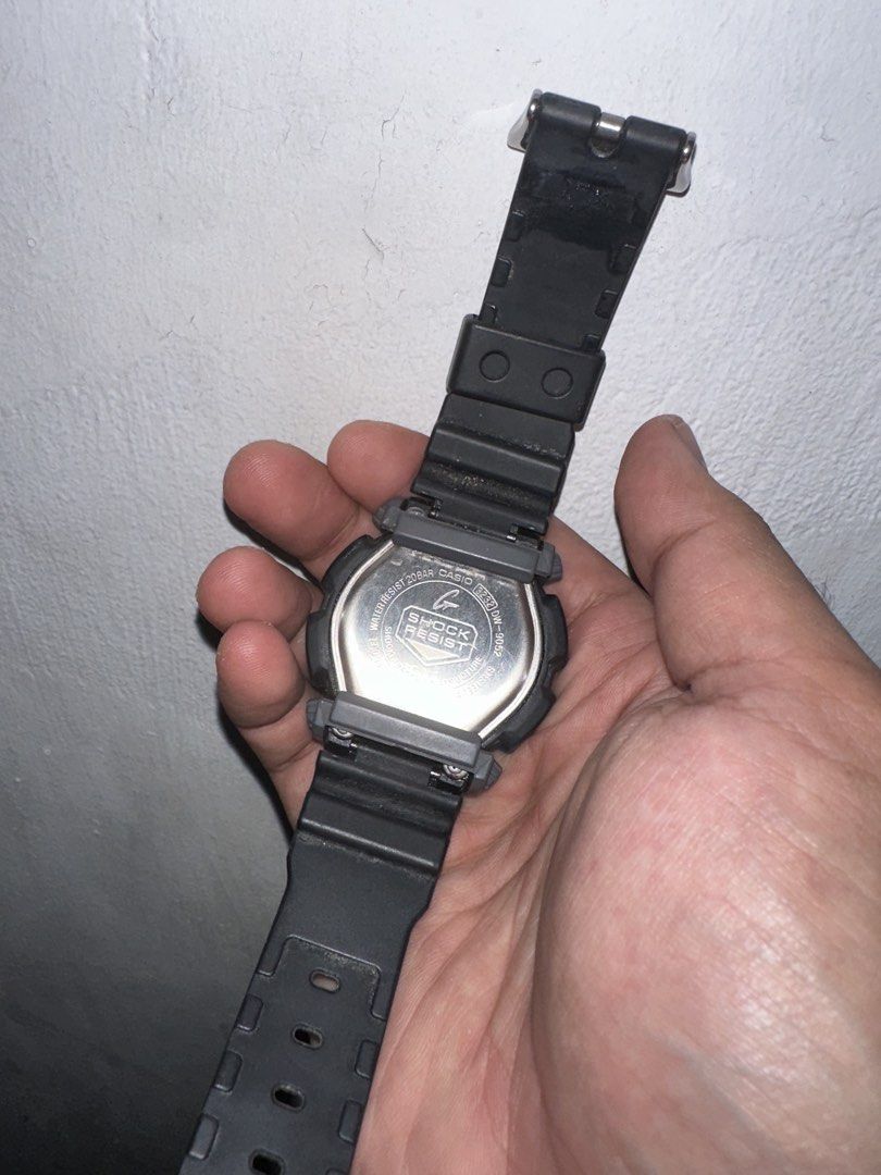 Casio G-Shock DW-9052 Digital Watch (Category: Men's Watches) located in Cavite. Submitted by mikeyyyy10 (Listing ID 1465960921, Image 2). Description: - Brand/Model: Casio G-Shock DW-9052 - Color: Classic black resin strap and bezel - Condition: Working digital display, standard signs of regular wear - Durability: Stainless steel case back, 20 bar water resistance - Closure: Standard buckle - Perfect reliable everyday sport watch!.