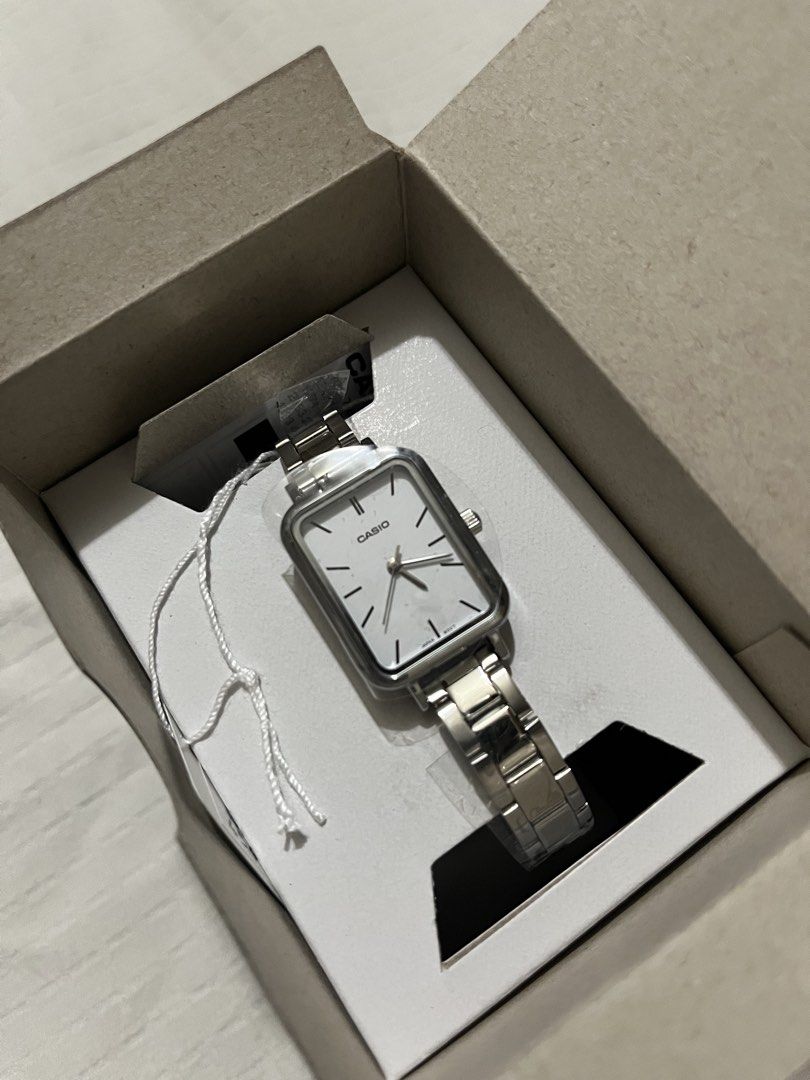 Casio White Face stainless steel analog watch (Category: Women's Watches) located in Quezon City. Submitted by earthtodior (Listing ID 1466037428, Image 1). Description: - Brand: Casio wristwatch - Condition: Brand new, unworn, still wrapped in original plastic film with tag attached - Design: Rectangular silver-tone dial with stick markers and metal link bracelet strap - Style: Clean, minimalist everyday look - Inclusions: Comes with original pr