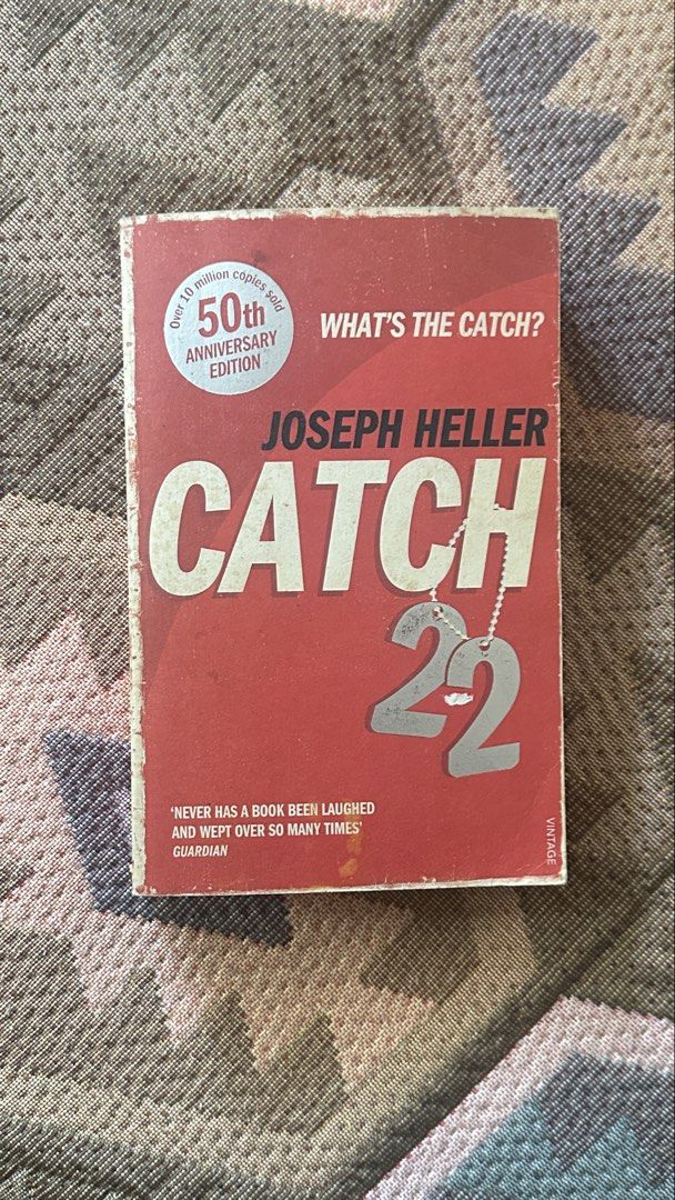 Catch-22 by Joseph Heller 50th Anniversary Edition (Category: Storybooks) located in Manila. Submitted by goldschlagered (Listing ID 1465962905, Image 1). Description: - Title: Catch-22 by Joseph Heller - Edition: 50th Anniversary Vintage Edition (Paperback) - ISBN: 978-0-099-52912-5 - Condition: Pre-loved with vintage charm. Pages have natural yellowing from age; cover has light edge wear - Binding: Solid and intact, perfect for reading. Price n