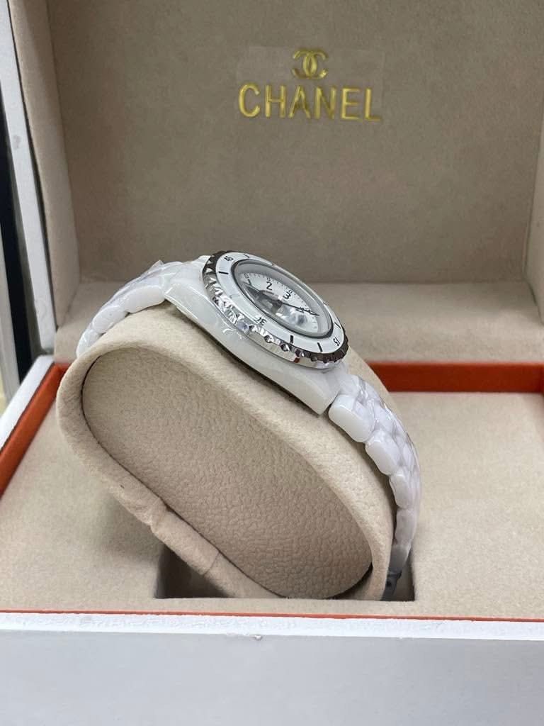 CC J12 White Ceramic Watch (Category: Luxury Watches) located in Manila. Submitted by bagsandmanymanymore1 (Listing ID 1465964010, Image 2). Description: - Brand: CC Watch J12 -Size 40mm - Material: High-tech white ceramic with stainless steel deployment clasp (marked Swiss Made) - Dial: Classic round face with easy-to-read Arabic numerals and rotating bezel - Condition: Pristine, protective plastic wrap still intact on the ceramic bracelet links