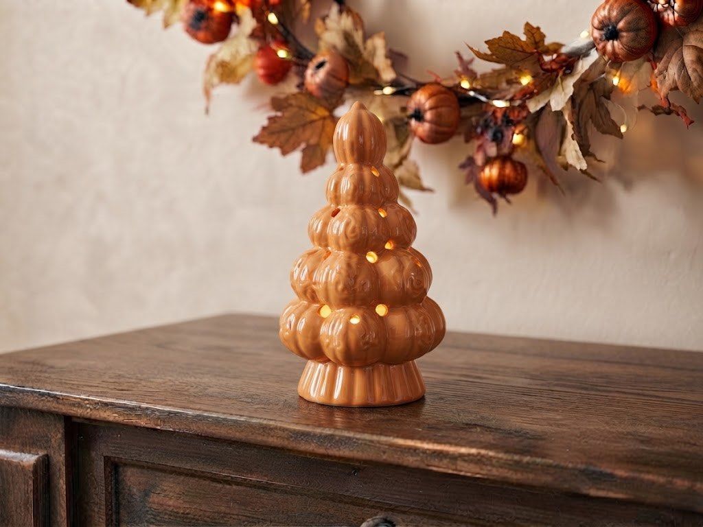 Ceramic Pumpkin Tree Autumn Decor Lantern (Category: Lighting) located in Baguio. Submitted by the_general_store (Listing ID 1466099659, Image 1). Description: - Glossy orange ceramic pumpkin tree - Stacked mini pumpkins form the tiers - Dotted holes allow light to shine through - Hollow base fits a tea light or small bulb - Ideal tabletop accent for fall and Halloween decorating *Dimensions: height 9”, base 3.75”, circumference 15” (widest part)