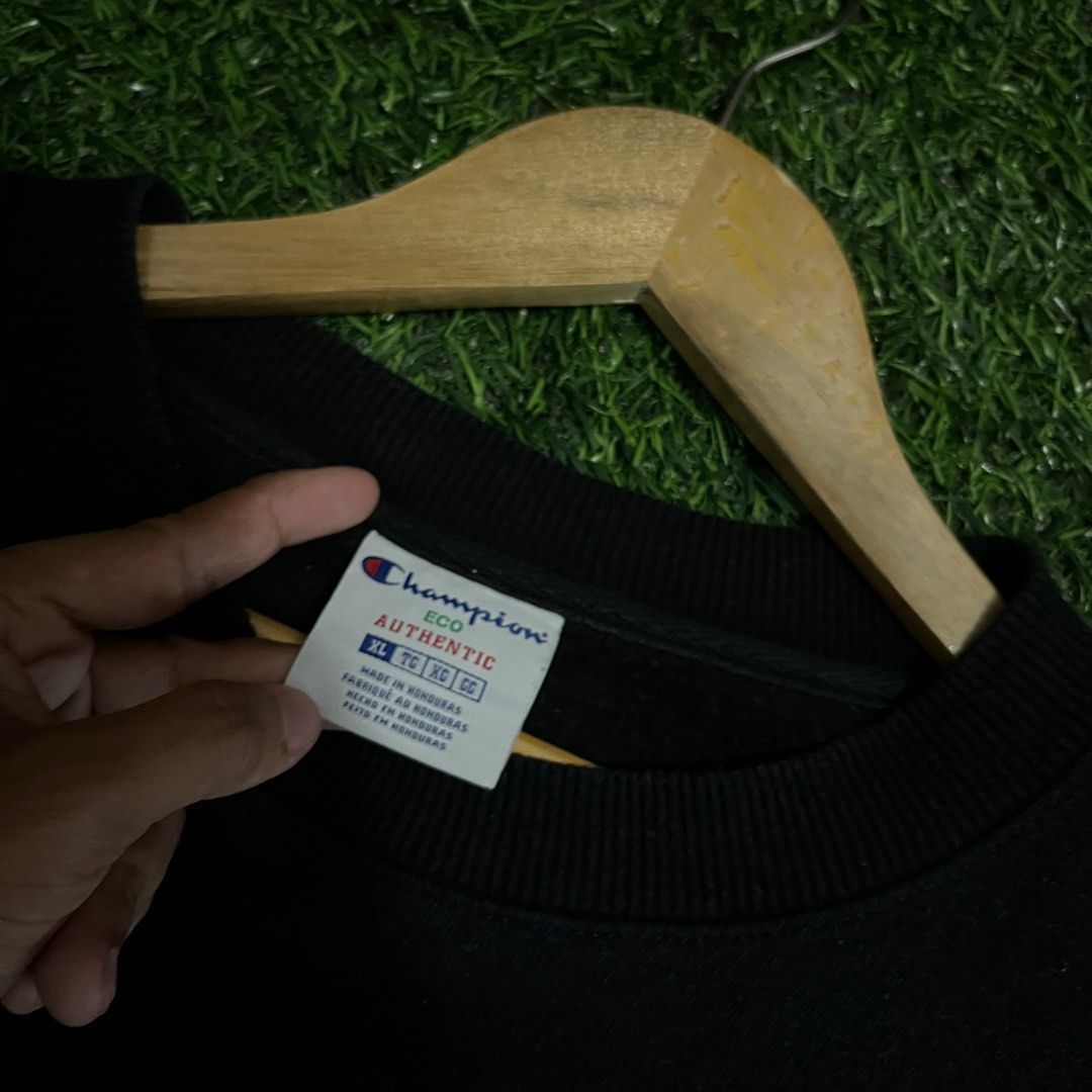 Champion Eco Authentic Black Sweatshirt XL (Category: Coats, Jackets and Outerwear) located in Argao. Submitted by secondcyclecollection (Listing ID 1465965366, Image 3). Description: - Brand: Champion Eco - Color: Solid black - Size: Extra Large (XL) - Material/Interior: Warm fleece lining - Design: Classic crewneck, ribbed cuffs and hem, subtle embroidered chest logo - Origin: Made in Honduras - Condition: Authentic and great for casual outfits