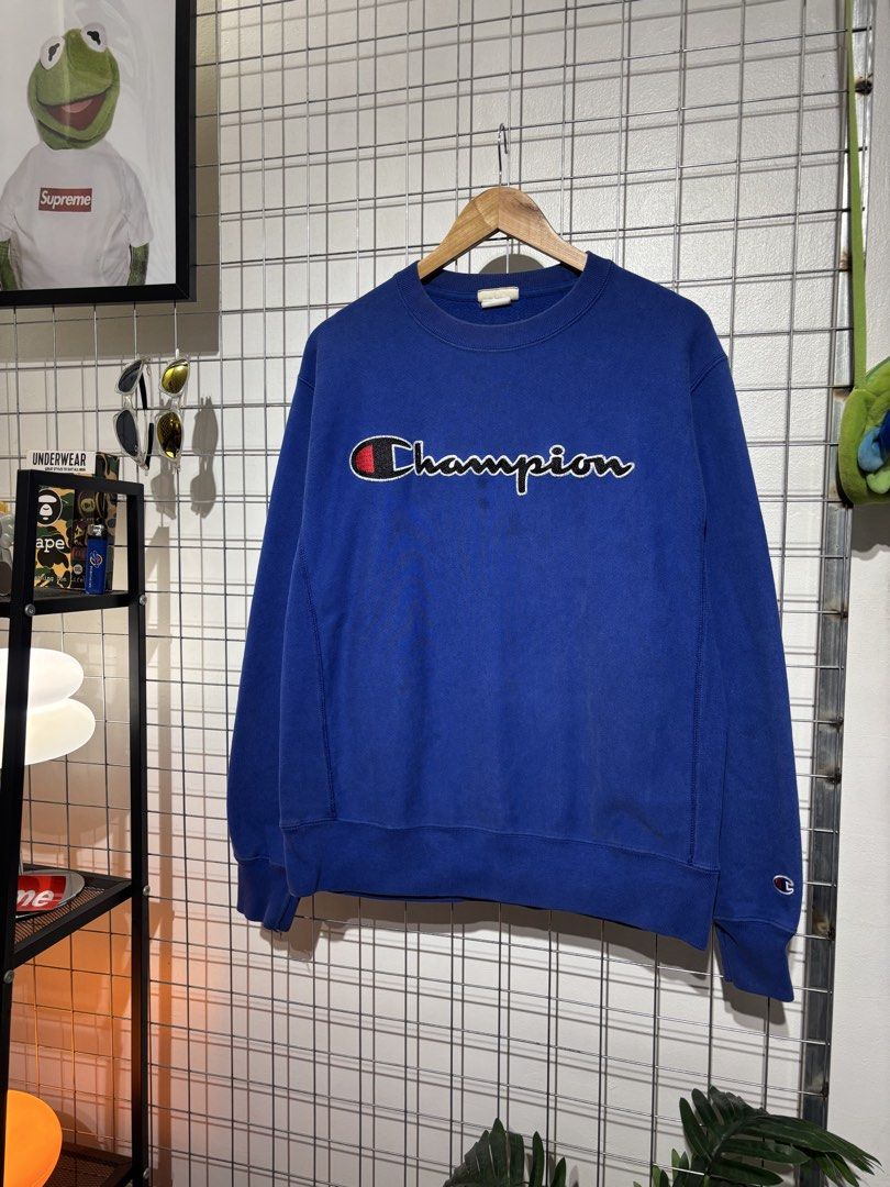 Champion Reverse Weave Blue Script Logo Crewneck Sweatshirt (Category: Coats, Jackets and Outerwear) located in Cavite. Submitted by vlblgrmnts_ (Listing ID 1466065102, Image 2). Description: - Brand: Champion - Style: Reverse Weave Heavyweight Sweatshirt - Color: Bright Royal Blue with white/black cursive script logo and red C accent - Size: Medium (Made in Honduras) - Details: Small embroidered Champion logo on left wrist, signature side gusset