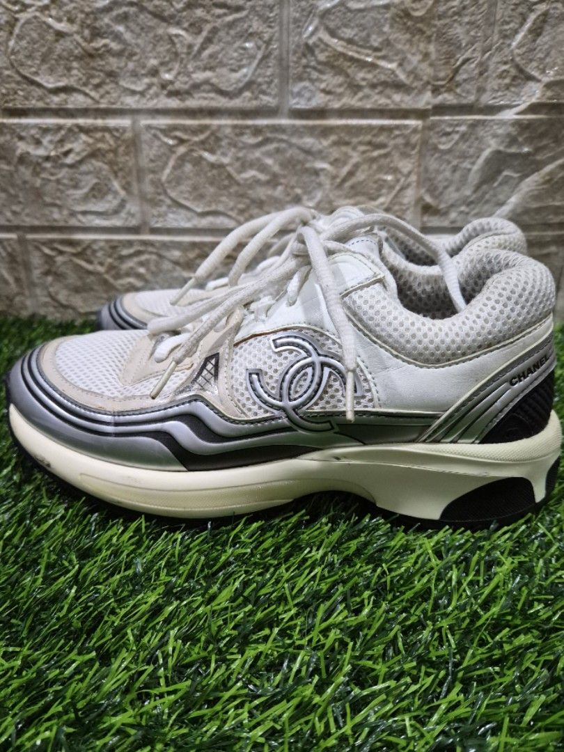 Chanel Fabric & Laminated White & Silver Sneakers (Category: Sneakers & Footwear) located in Antipolo. Submitted by saribymonica (Listing ID 1466129897, Image 3). Description: 👟 CHANEL Laminated & Fabric CC Runner Sneakers 👟 Size: 36 EU Condition: Beautifully clean, structured, and ready to wear! About this pair: Absolute luxury meets street style. These feature the iconic chunky silhouette with double CC branding on the side, laces, and sole t
