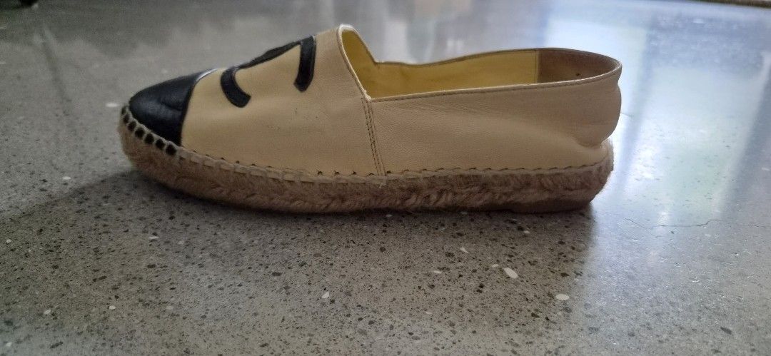 Chanel Leather Espadrilles Beige Black CC Logo Size 35C (Category: Sneakers & Footwear) located in Angeles City. Submitted by agida (Listing ID 1466008427, Image 3). Description: - Brand: Chanel - Style: Leather espadrilles (Beige & Black) - Size: 35C - Features: Iconic stitched CC logo, classic jute rope midsole, and patterned rubber outsole - Condition: Inner lining shows some wear and dirt stains; soles have standard walking wear from previous