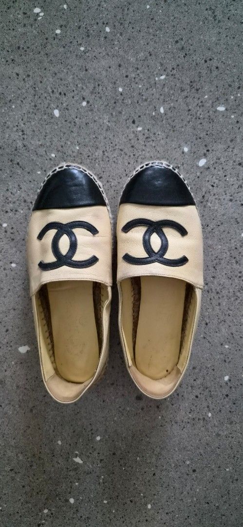 Chanel Leather Espadrilles Beige Black CC Logo Size 35C (Category: Sneakers & Footwear) located in Angeles City. Submitted by agida (Listing ID 1466008427, Image 2). Description: - Brand: Chanel - Style: Leather espadrilles (Beige & Black) - Size: 35C - Features: Iconic stitched CC logo, classic jute rope midsole, and patterned rubber outsole - Condition: Inner lining shows some wear and dirt stains; soles have standard walking wear from previous