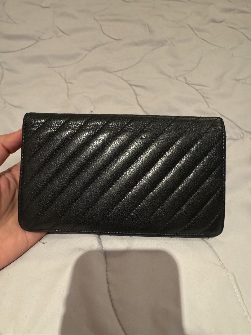 Chanel Long Wallet (Category: Luxury Bags & Wallets) located in Pasay City. Submitted by iflyph (Listing ID 1466154862, Image 3). Description: - Authentic Chanel wallet - Black textured leather - Multiple card slots - Bill compartments - Coin storage 1 flaw card slot fabric inside needs stitching hence selling low (see last pic) everything else in good condition beautiful in actual 7/10 condition guaranteed authentic or money back no return no ex