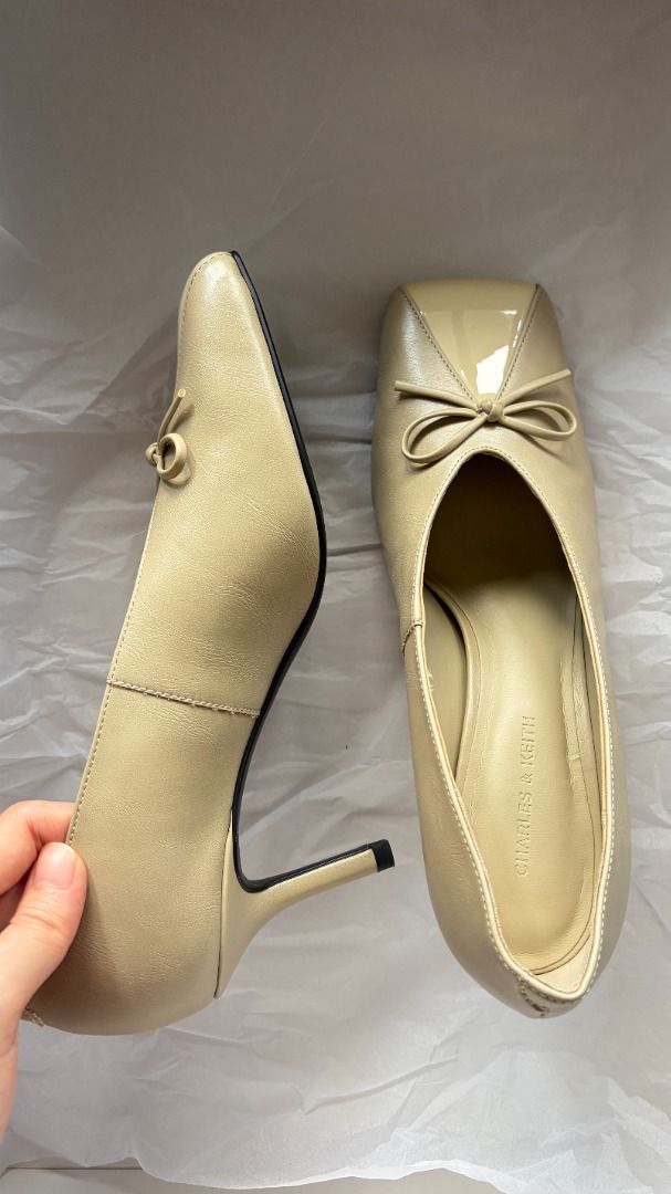 Charles & Keith Beige heels with bow detail (Category: Heels) located in Makati City. Submitted by savvy_girl (Listing ID 1466017725, Image 3). Description: - Condition: Brand new with shoe bag - Color: Versatile neutral beige - Design: Modern square toe with a dainty front bow accent - Heel: Comfortable mid-height kitten heel - Fit: Easy slip-on style - Styling: Perfect for office wear, meetings, or casual day-outs RFS: Was a gift but is too big