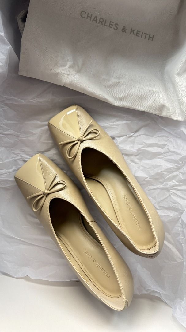 Charles & Keith Beige heels with bow detail (Category: Heels) located in Makati City. Submitted by savvy_girl (Listing ID 1466017725, Image 2). Description: - Condition: Brand new with shoe bag - Color: Versatile neutral beige - Design: Modern square toe with a dainty front bow accent - Heel: Comfortable mid-height kitten heel - Fit: Easy slip-on style - Styling: Perfect for office wear, meetings, or casual day-outs RFS: Was a gift but is too big