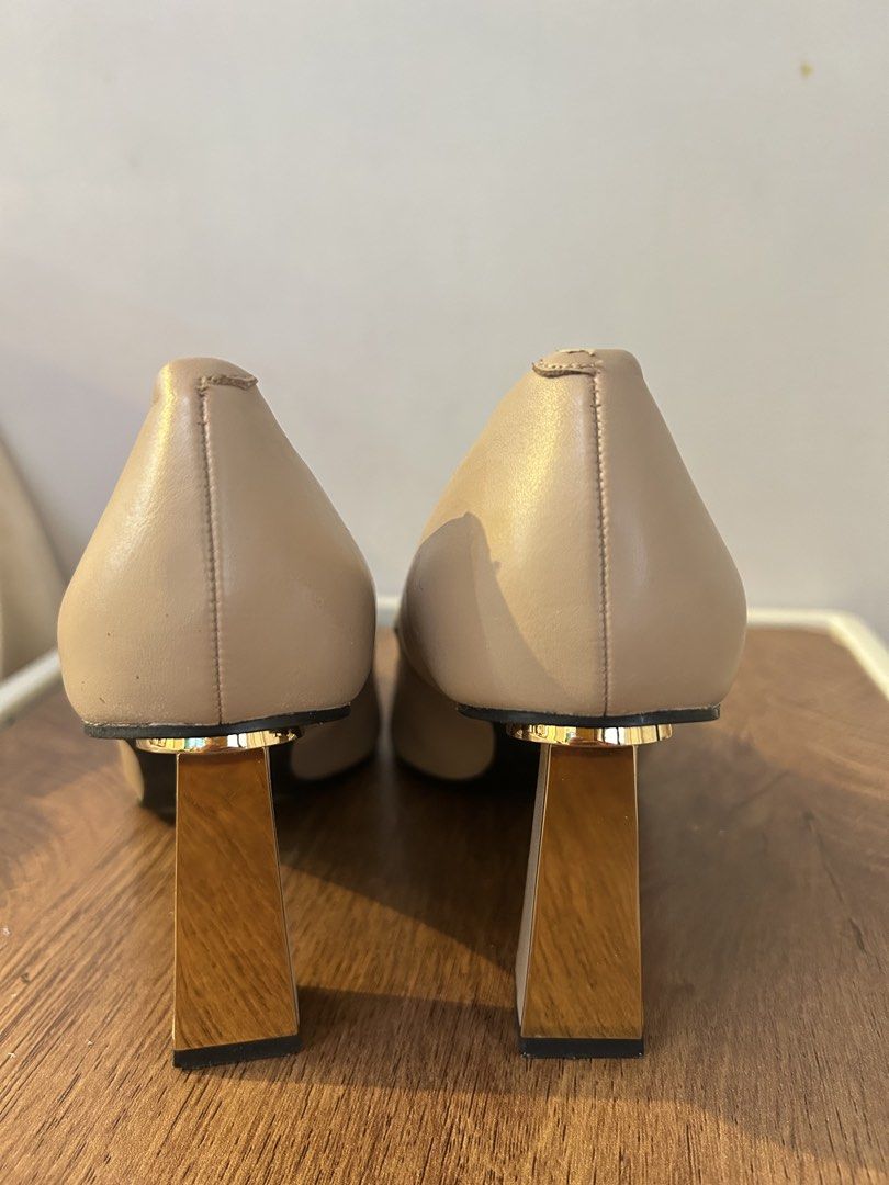 Charles & Keith Nude Pointed Toe Heels Size 37 (Category: Heels) located in Taguig. Submitted by fastflower.02faa3 (Listing ID 1466084883, Image 3). Description: - Brand/Model: Charles & Keith Nude Heels - Size: 37 / 235 (fits true to size) - Design: Slip-on, pointed toe, elegant neutral color - Heel: Unique gold metallic block heel (great height for work or events) - Condition: Sturdy overall with some wear inside near the lining and minor scuff