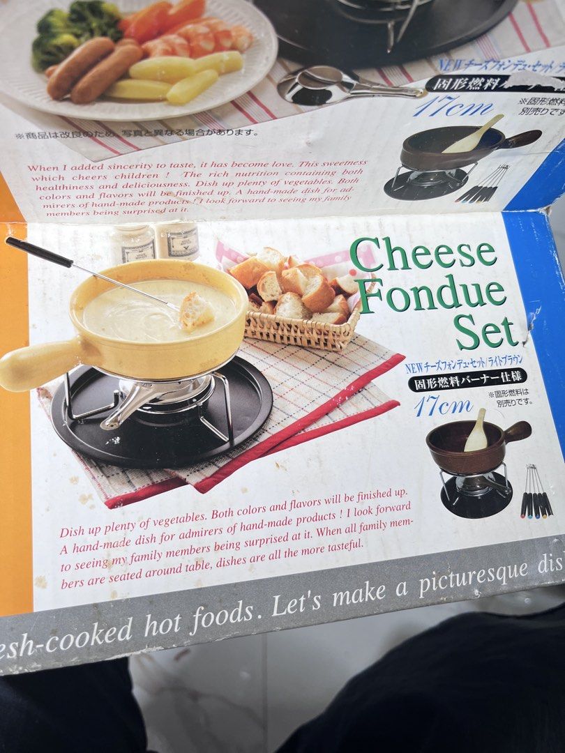 Cheese Fondue Set 17cm Light Brown (Category: Cookware & Accessories) located in Quezon City. Submitted by altheakatecollection (Listing ID 1465994507, Image 1). Description: - Complete 17cm cheese fondue set in a chic light brown color - Brand new, still packed in original plastic wrap and box - Includes ceramic pot, metal stand, base plate, multiple fondue forks, and a wooden spatula - Perfect for family dinners, date nights, and holiday partie