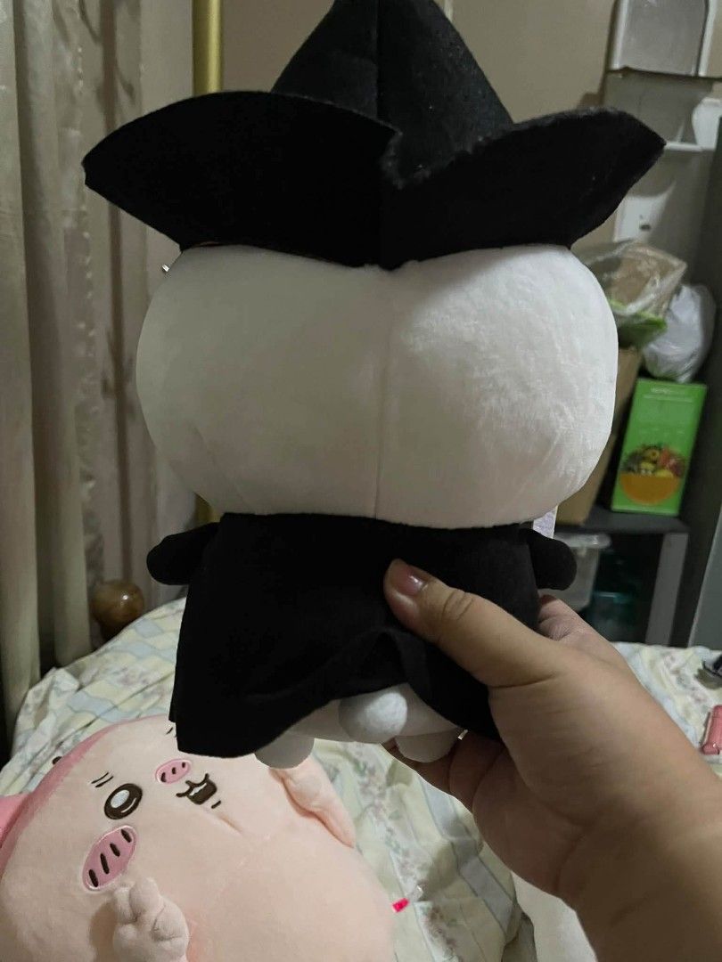 Chiikawa Witch Plush Toy (Category: Plushies & Soft Toys) located in Bacolod City. Submitted by mariowos (Listing ID 1466064739, Image 2). Description: - Character: Chiikawa in a wizard outfit - Details: Wearing a black wizard hat and robe with embroidered face and pink cheeks - Condition: Clean, well-kept, and official tag attached near the back - Material: Soft white and black fabric.